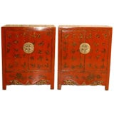 A Pair Of Red Lacquer Cabinets With Gold Gilt Motif