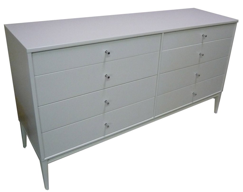 Paul McCobb Planner group 8 drawer dresser. New lacquered finish with polished nickel hardware. Solid maple construction throughout.

Paul McCobb (1917-1969) is an American designer best known for the Planner Group, his collection of clean,