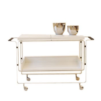 Horst Bruning for Kill International modernist tea / bar cart. Flip top detail server area makes for a great server. All original materials and casters.Please call to schedule an appointment to view this piece as this is not located at the 142 Henry