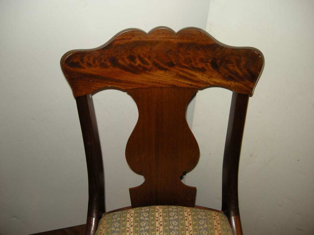 Classic American Empire late 19th century mahogany chairs.Harp backs,curvaceous legs,vintage tapestry upholstery.Very elegant and shapely chairs.