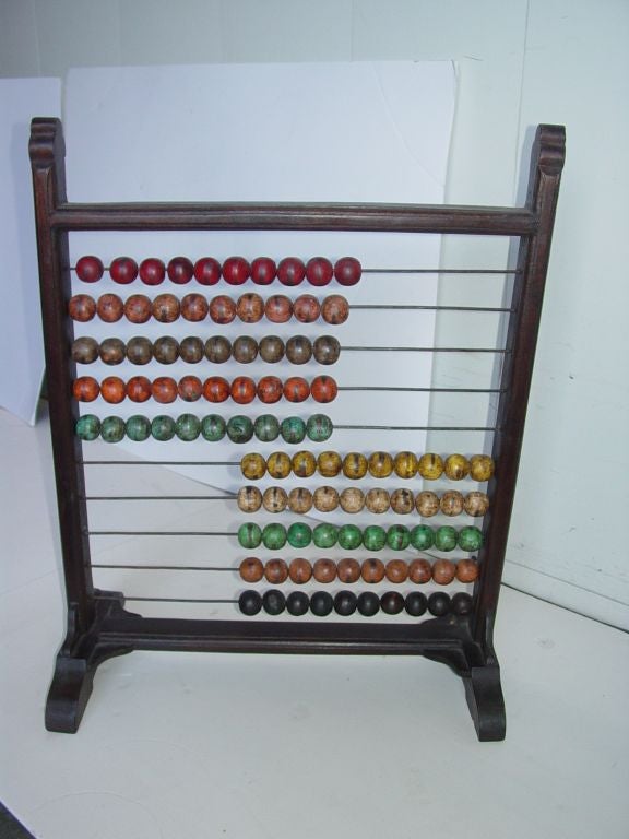 Antique African Counting Frame or Abacus,Wood frame.metal bars with multi colored wood shere's in blue,green,black,brown and red.