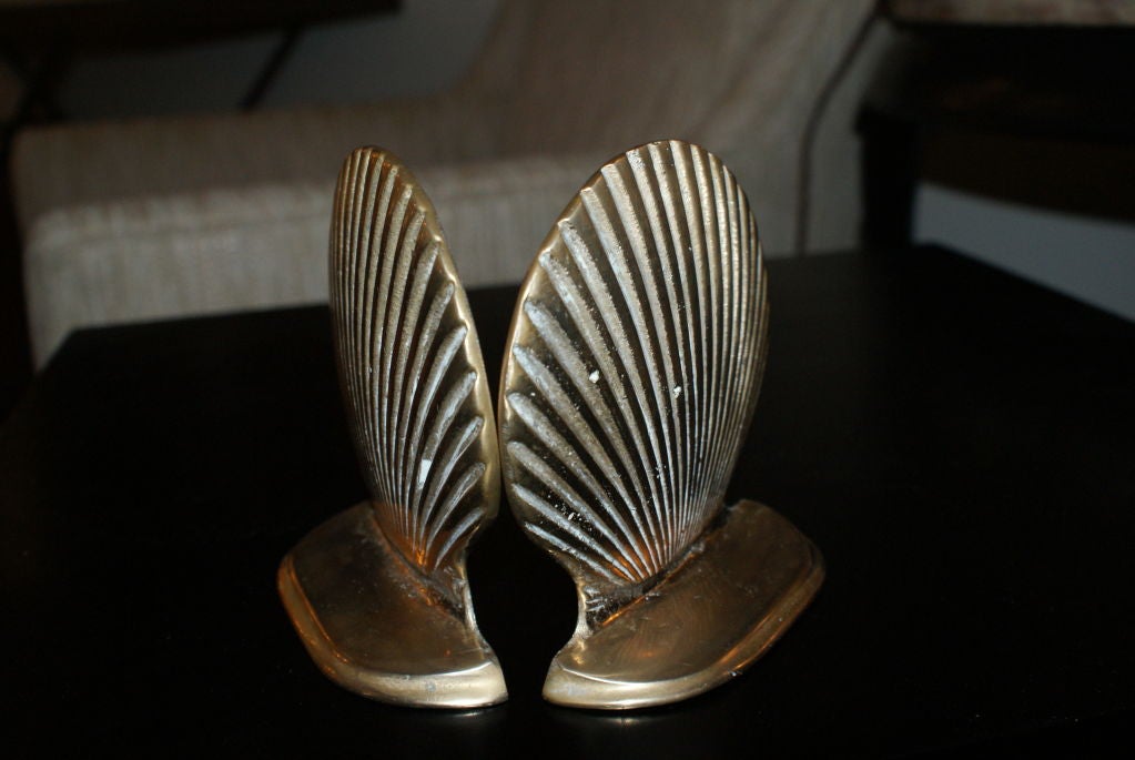 Handsome pair if miniture solid brass shell for bookends.