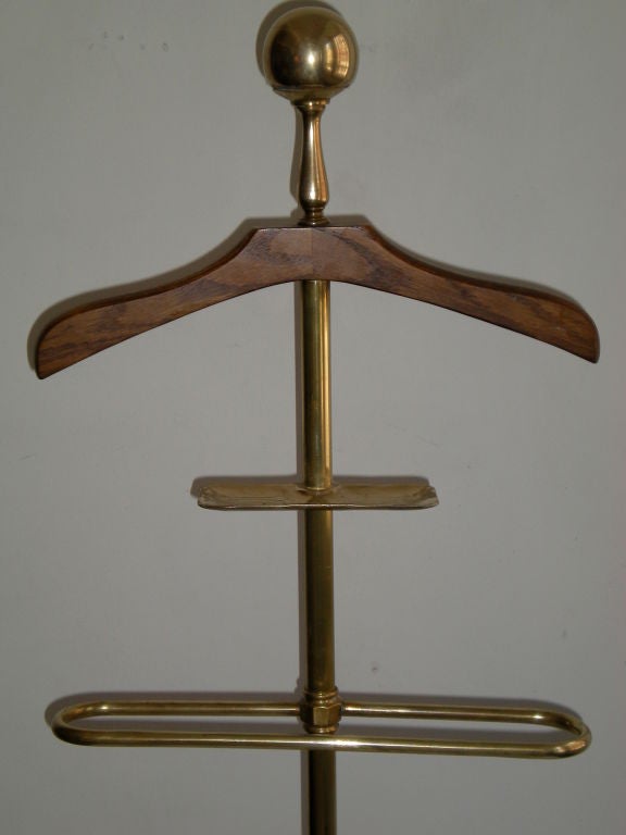 Dating from early 20th century;wood coat hanger,and change tray,tripod base with hoofed feet.A great bedroom accessory.Can be disassembled for shipping.