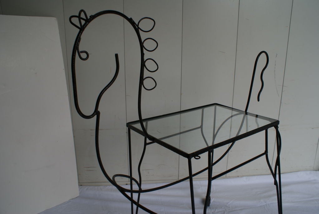 Frederick Weinberg, Iron Figural table on casters.Glass top,wonderful indoor outdoor trolly / table.