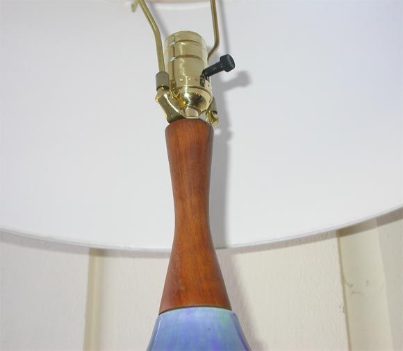 Beautiful ceramic Haeger lamp,with peacock feather brush strokes in hues of blues and greens.Wooden neck and base.