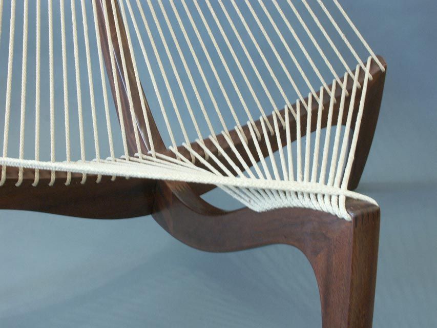 Beautiful vintage example of the Harp by Hovelskov. A masterful exercise in material conservatism, the form more than makes up in its visual complexity. The expertly crafted frame, in solid walnut, anchors the hypnotic weaving of the jute cord