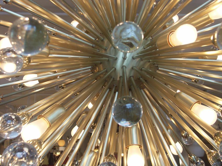 Even larger than the previous examples we have had the pleasure to offer, this chandelier is truly breathtaking. Nearly 4' in diameter, with close to 200 individual arms, each with a clear glass orb at tits tip. The lamp is in like new unused