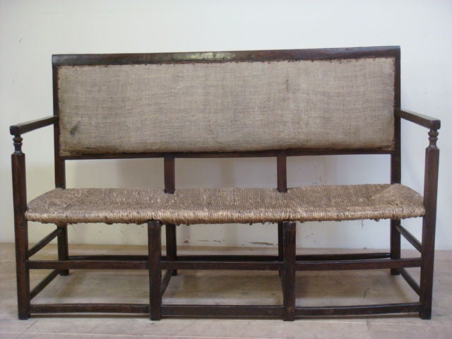 An original cherrywood provincial bench. completely restored, but retaining original rush seat. frame is tight and wood is clear waxed.