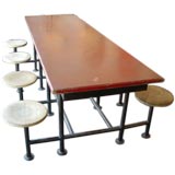 Red Iron Table With Eight Attached Stools