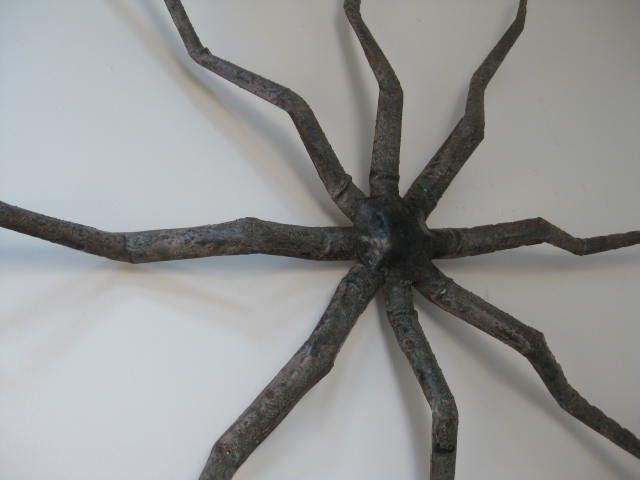 large iron octopus. specific origin/use unknown. three available. sold individually. traces of paint.