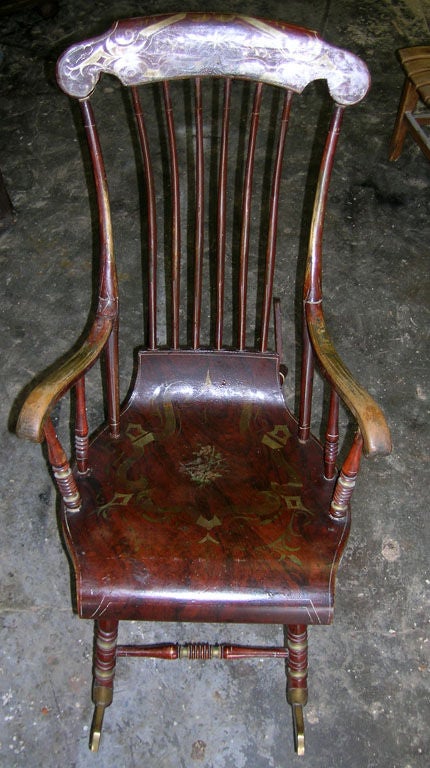 Classic Swedish rocking chair with unusual paint. These chairs were usually painted black. The wood grain and floral finish is rare. This six legged style was made between 1830 and 1850, after that the 4 legged version took over. Please note the