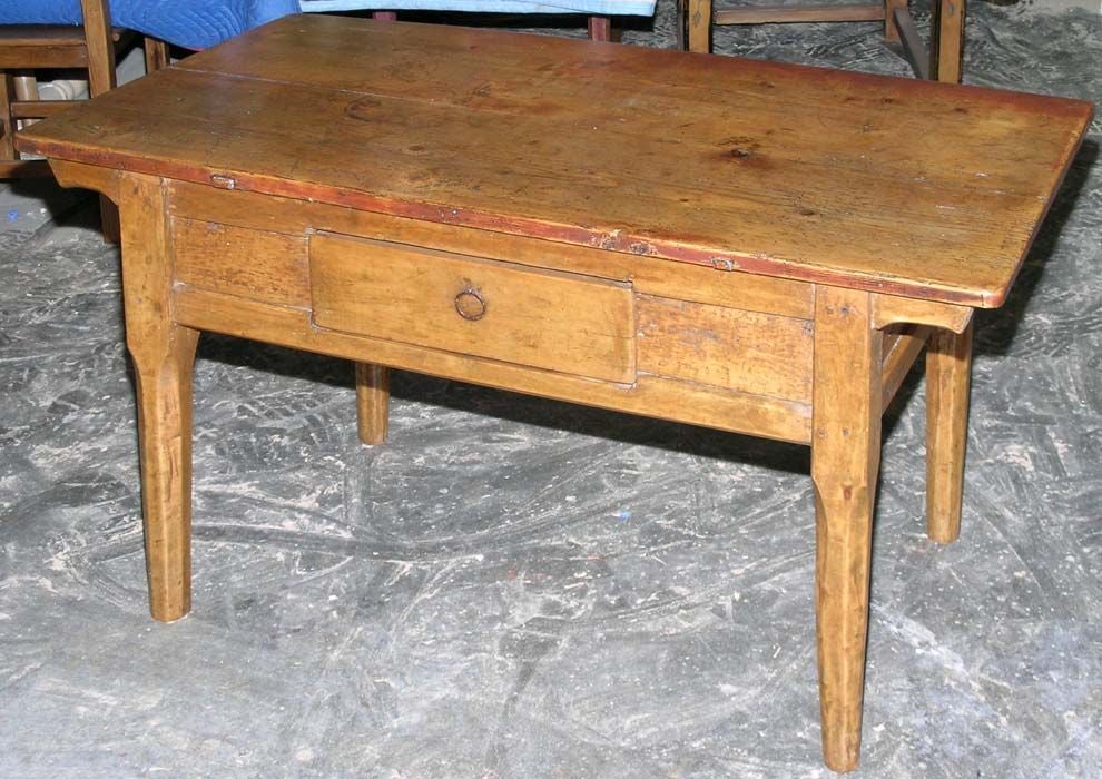 Country table with great character and patina. Base and legs are birch, top is fir. Has one drawer.
