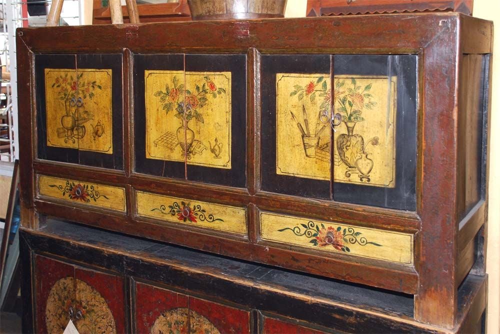 Mongolian sideboard with six doors and three seperate compartments as well as 3 drawers. Nicely lacquered with decorative floral design. Ideal as server or entertainment center.