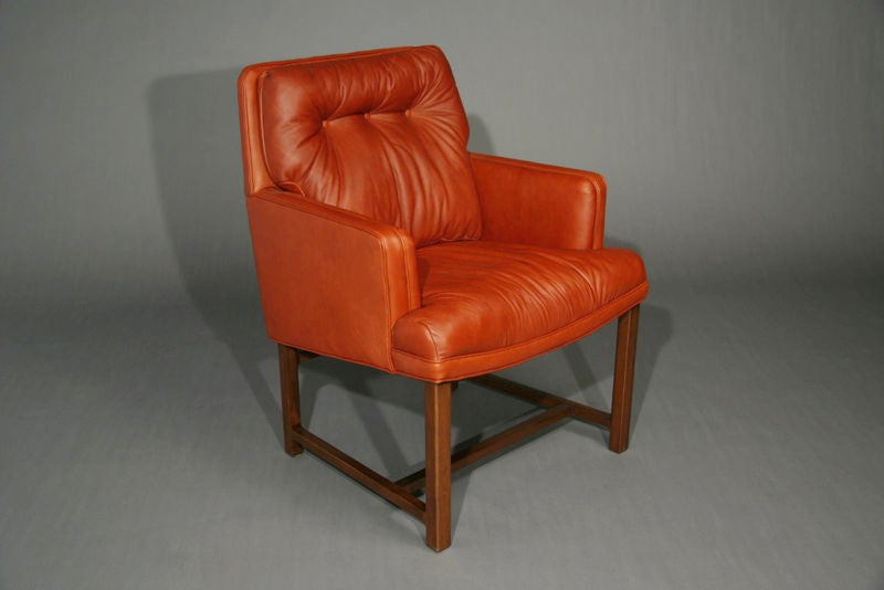 Pair of mahogany base and red soft leather arm chairs designed by Edward Wormley for Dunbar.  See also separate listing with curved Dunbar sofa.<br />
Seat depth is 17.5
