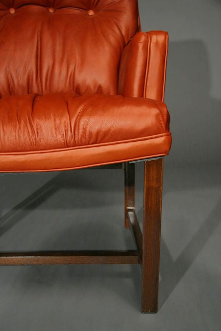 Mahogany Pair of mahogany and brick red leather arm chairs by Dunbar