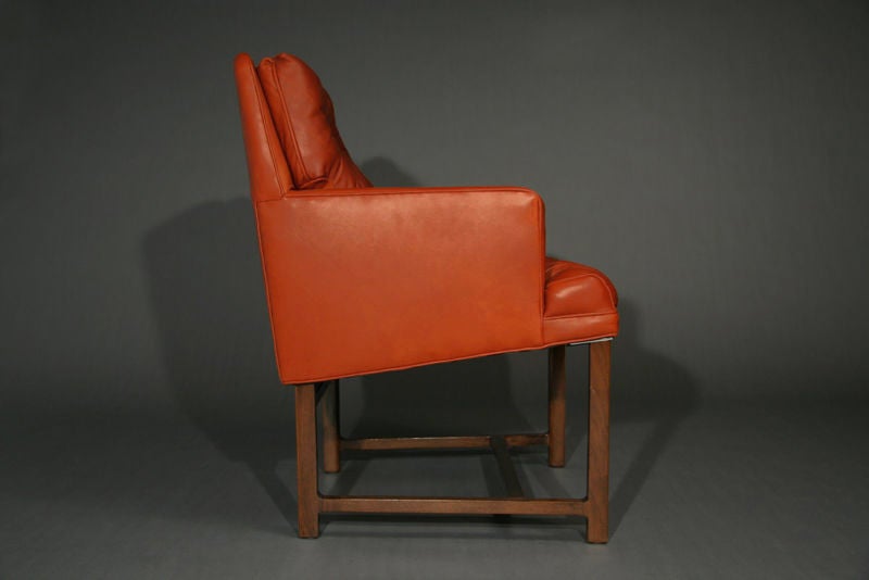 Pair of mahogany and brick red leather arm chairs by Dunbar 1
