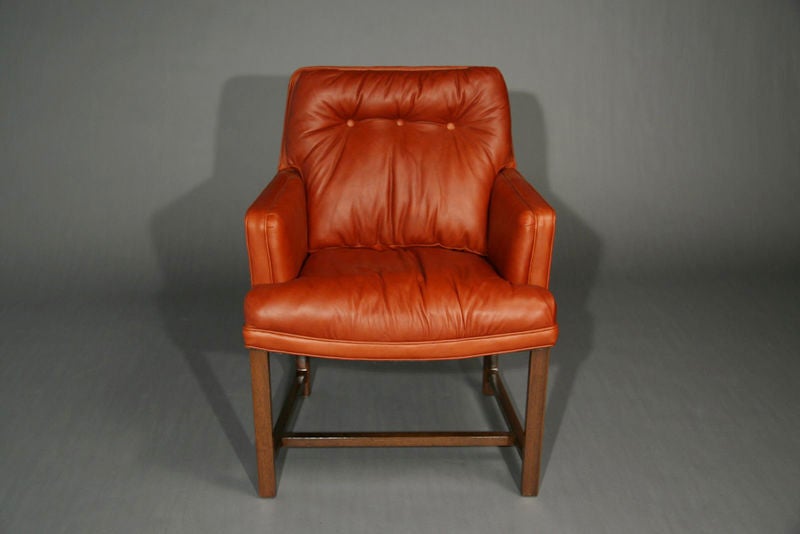 American Pair of mahogany and brick red leather arm chairs by Dunbar