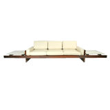 Rosewood and leather sofa with attached floating marble tables