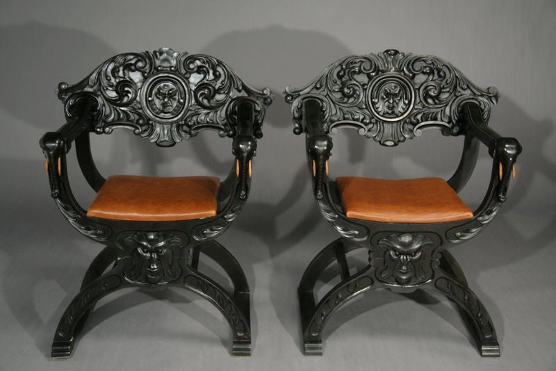 Pair of colonial style carved elephant head chairs