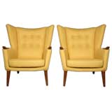 Pair of Danish lounge chairs with teak arms and legs