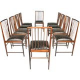 Set of ten rosewood spindle back leather dining chairs