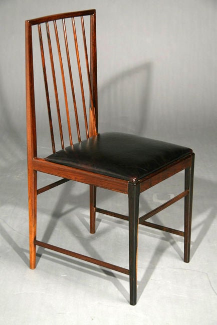 Set of ten rosewood spindle back leather dining chairs