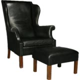 Black leather and teak wingback chair and ottoman