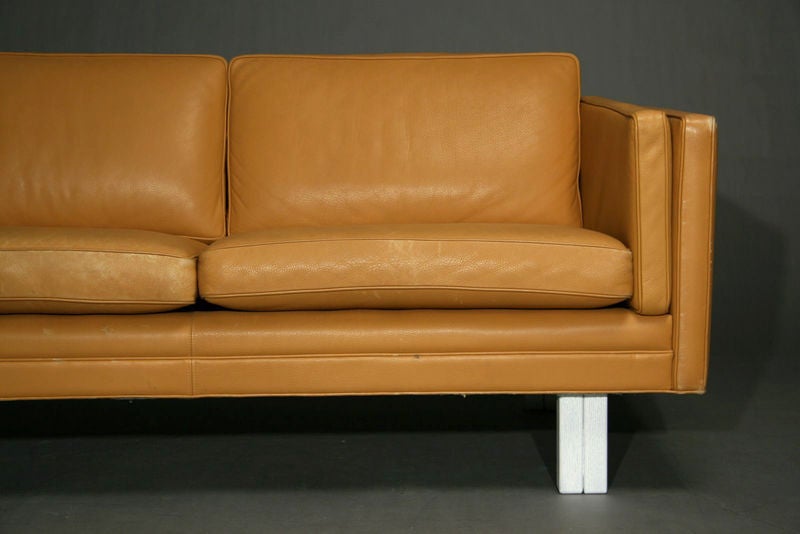 Camel color leather and oak settee