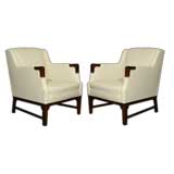 Pair of cream leather arm chairs with rosewood and bronze