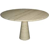 Round travertine pedestal dining table by Angelo Mangiarotti