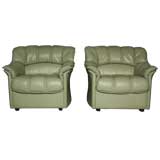Pair of green channel leather arm chairs