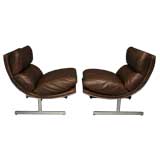Pair of sloped steel & leather lounge chairs by Kipp Stewart