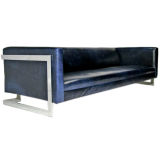 Cantilevered sofa in navy leather by Milo Baughman