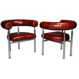 Pair of red leather "Cobra" lounge chairs