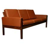 Rosewood and brick leather sofa by Hans Wegner