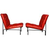 Pair of tufted red leather & bronze lounge chairs