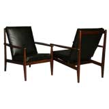Pair of black leather and rosewood lounge chairs by Gelli
