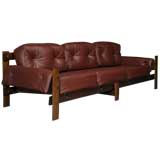Brazilian plum leather and exotic wood sofa
