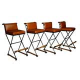 Set of four caramel leather bar stools by Cleo Baldin