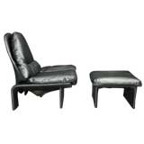 Overstuffed metallic gray lounge chair and ottoman