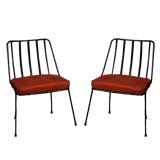 Pair of black iron and red suede chairs by Paul Laszlo