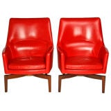 Pair of red leather and walnut lounge chairs by Jens Risom