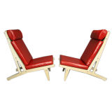 Pair of GE 375 red leather lounge chairs by Hans Wegner