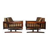 Pair of Brazilian rosewood and brown leather ski leg arm chairs