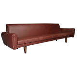 Plum leather and rosewood sofa by Soren Willadsen