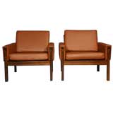 Pair of rosewood and brick leather arm chairs by Hans Wegner