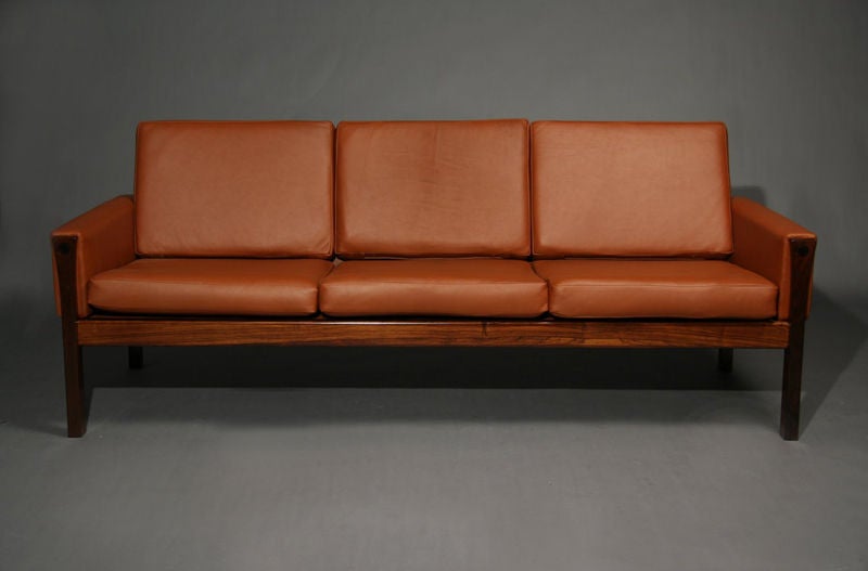 Rosewood and brick leather sofa by Hans Wegner