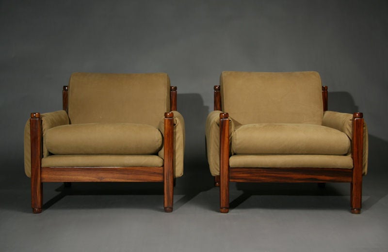 A pair of arm chairs from Brazil made of exotic wood frames and tan suede with wrap-around suede arm rests. See separate listing: Brazilian exotic wood and tan suede sofa.

Many pieces are stored in our warehouse, so please click on CONTACT DEALER