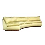 Curved yellow silk sofa by Milo Baughman