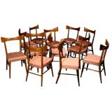 Set of twelve curved back pink silk dining chairs by Paul McCobb
